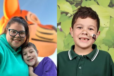 Woman in blue and boy with purple top and boy in green top
