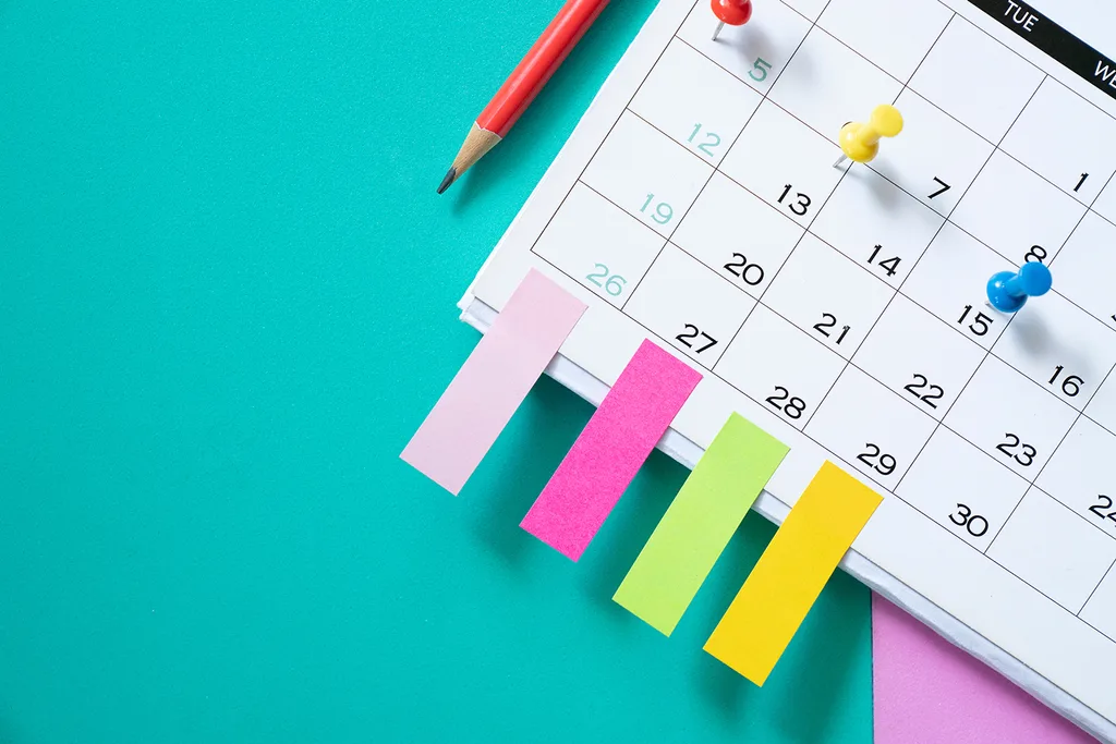 A calendar with four colourful tabs on the bottom