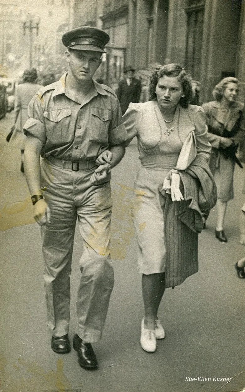 An old photograph of a woman and a man in Sydney, Australia. The man is wearing an army uniform.