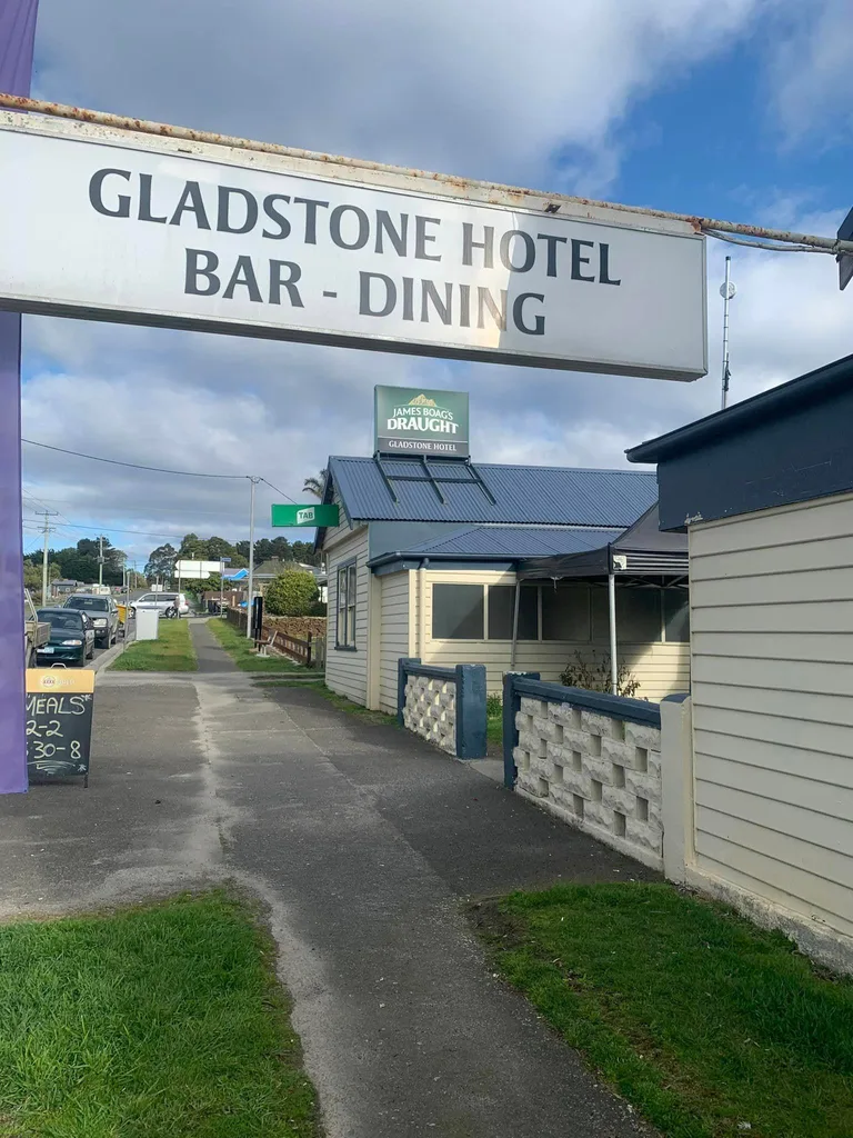 sign for Gladstone Hotel above street