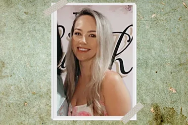 Woman with blonde hair wearing white floral dress