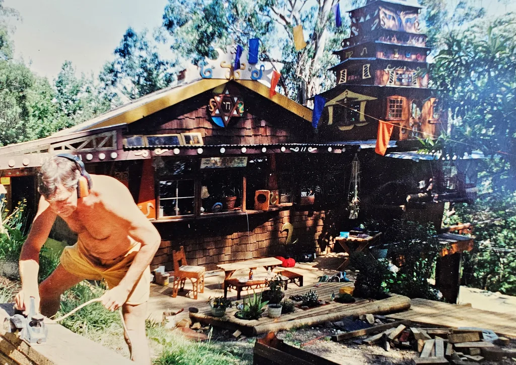 An old photograph of Bob building his treehouse