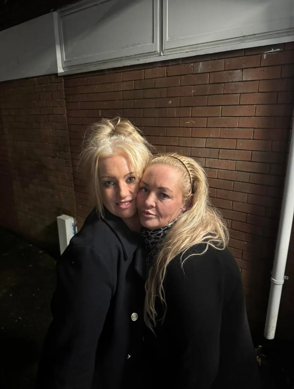 Image of two women smiling for a picture together