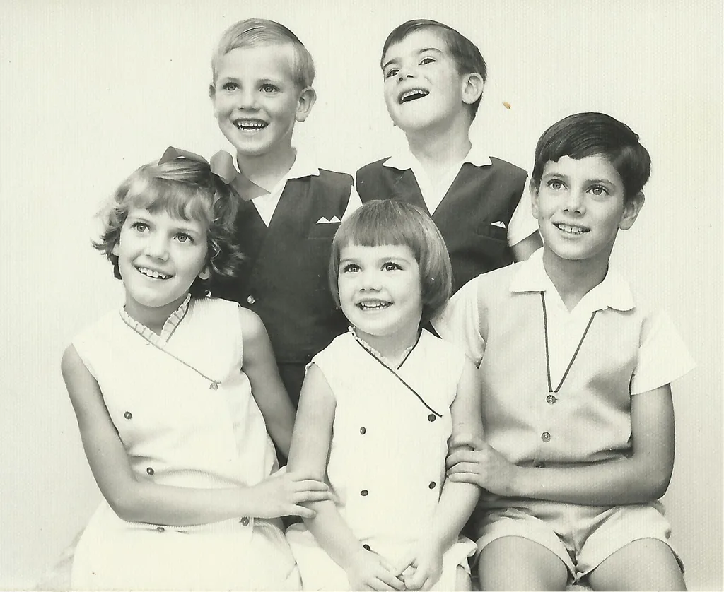 Black and white image of five kids smiling
