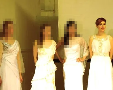 four women in white dresses