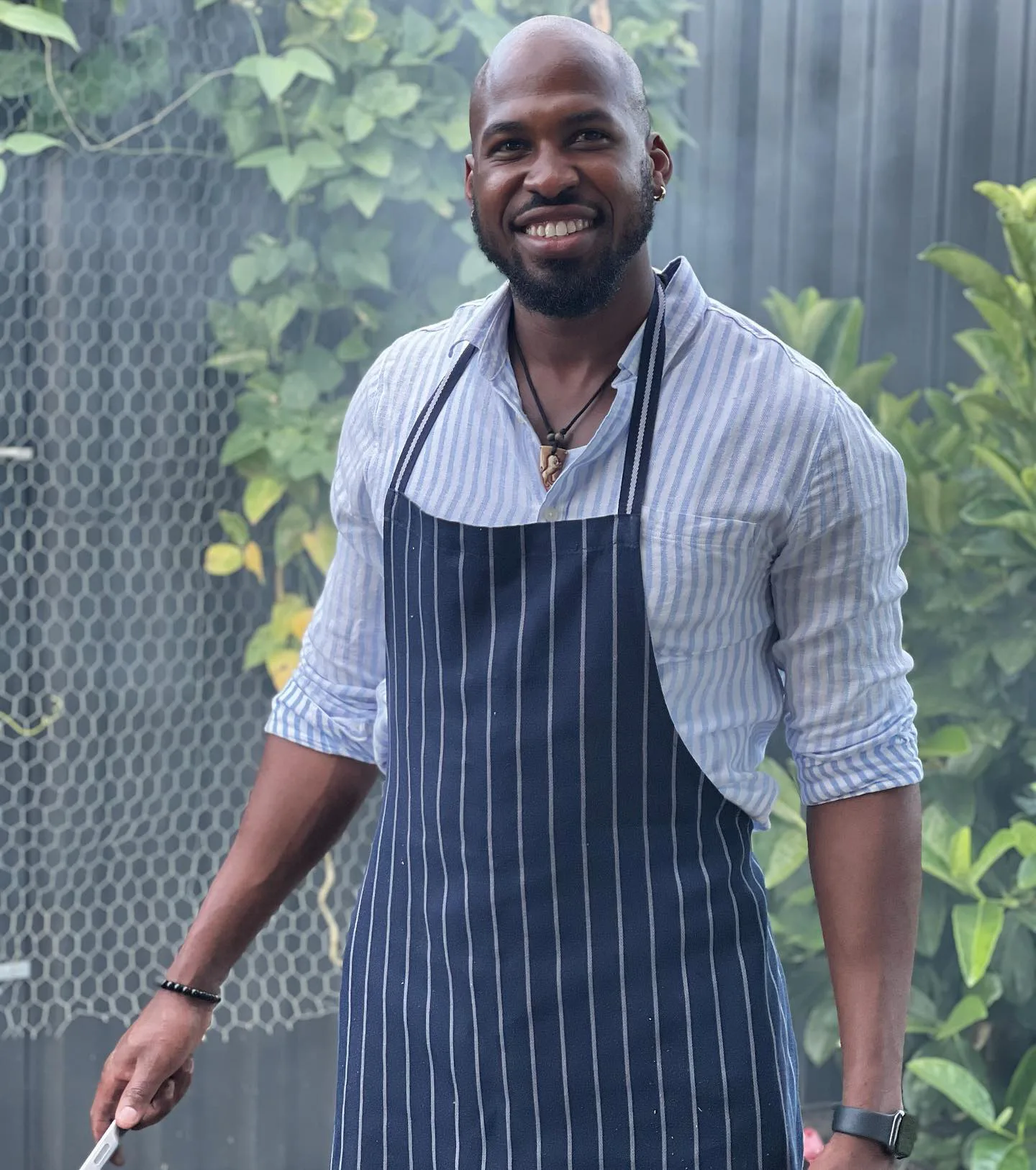 Image of man wearing chefs apron