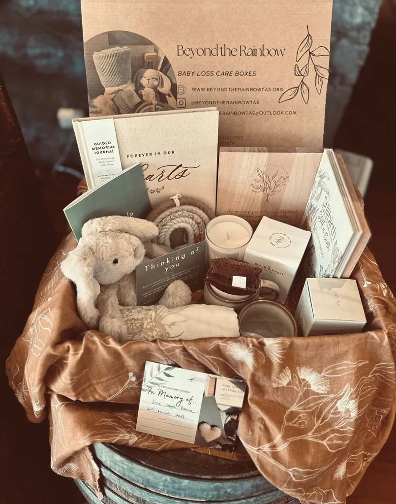 Box with cuddly rabbit, cnadles and journal and still birth book from beyond the Rainbow charity
