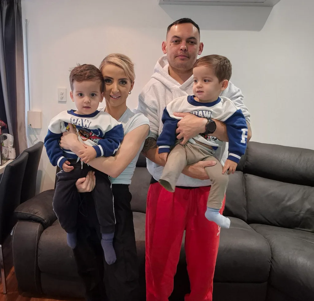 Image of mum and dad holding their twin boys