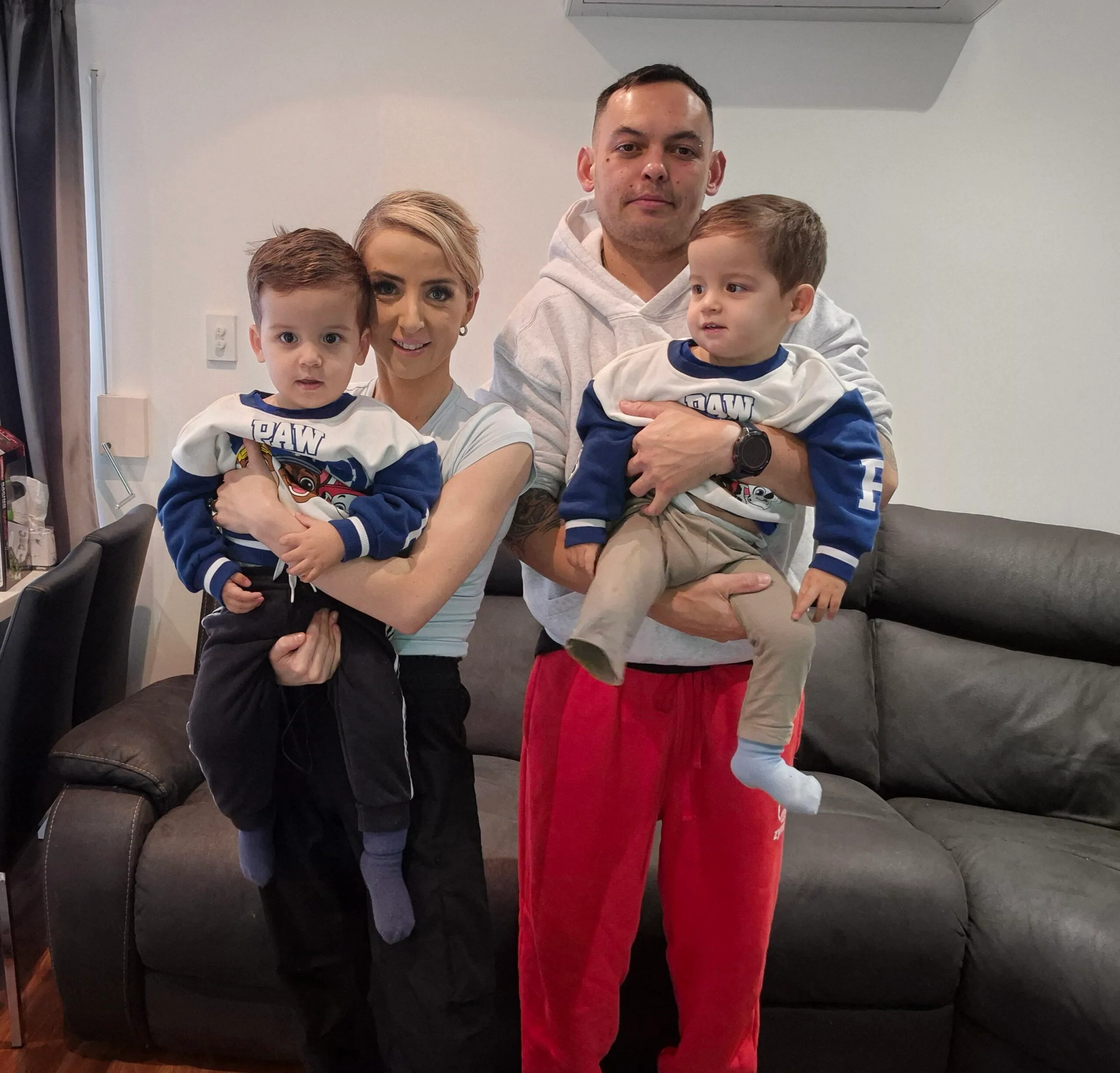 Image of mum and dad holding their twin boys