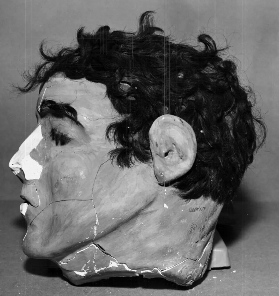 fake heads made out of cement powder and soap chips,