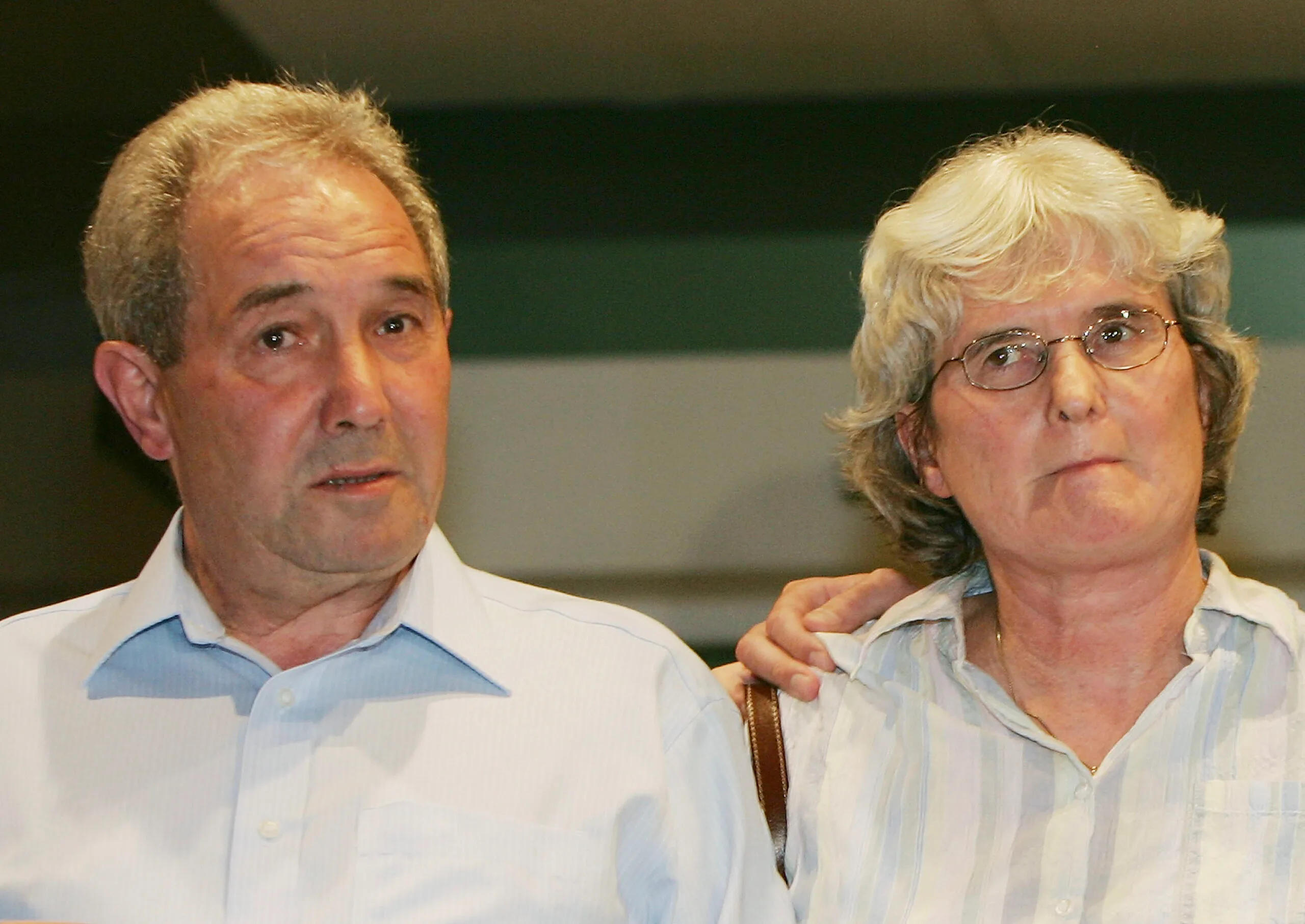 Man in shirt and woman in white shirt.