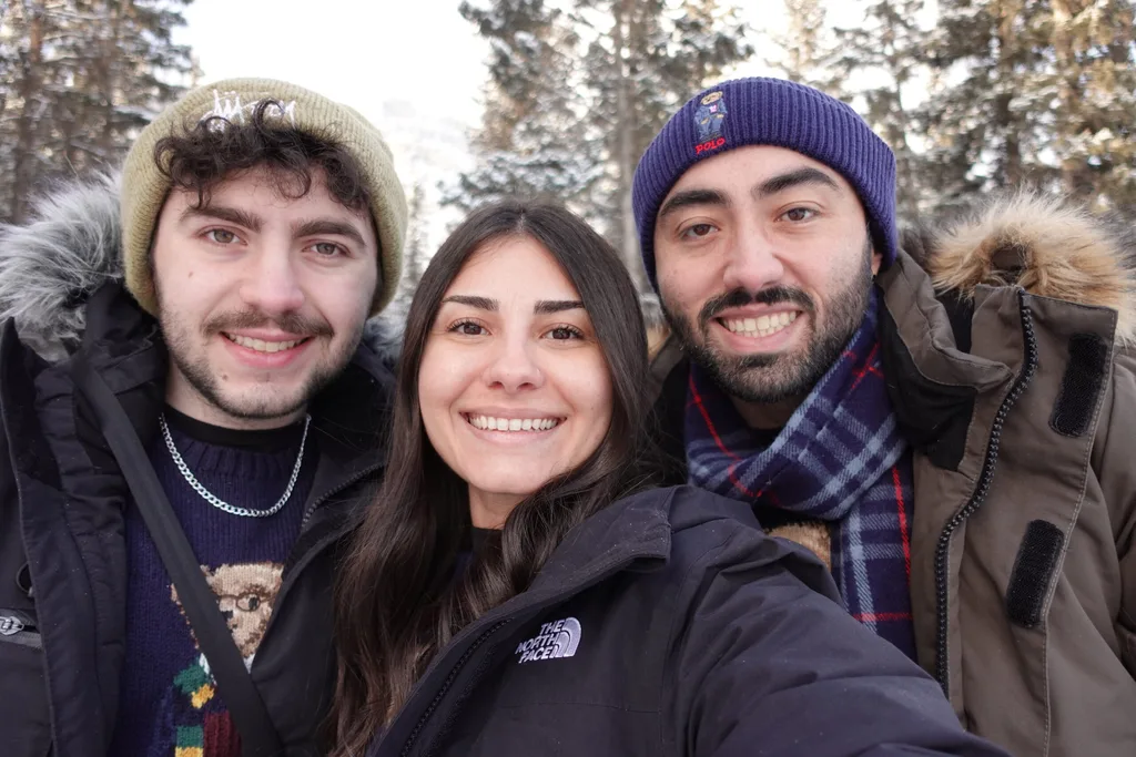 Image of three siblings smiling in Quebec Canada