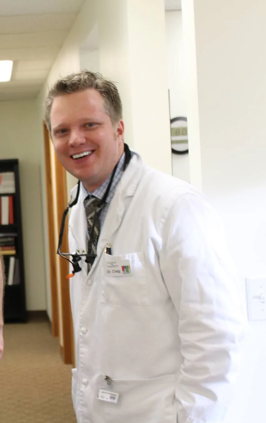 a man in a white lab coat