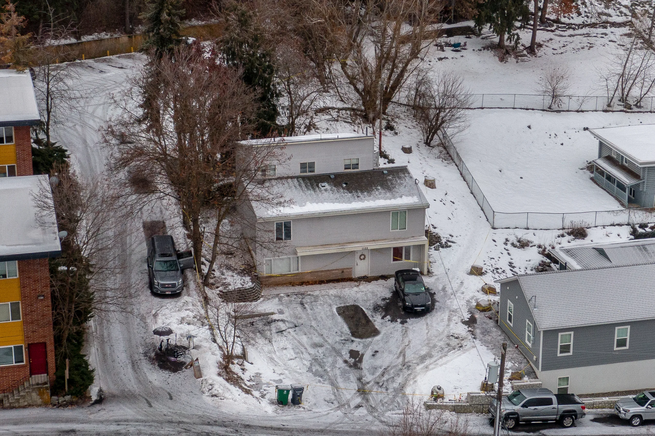 home in snow from aerial view