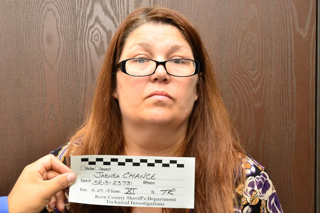 lady with glasses and brown hair for mug shot