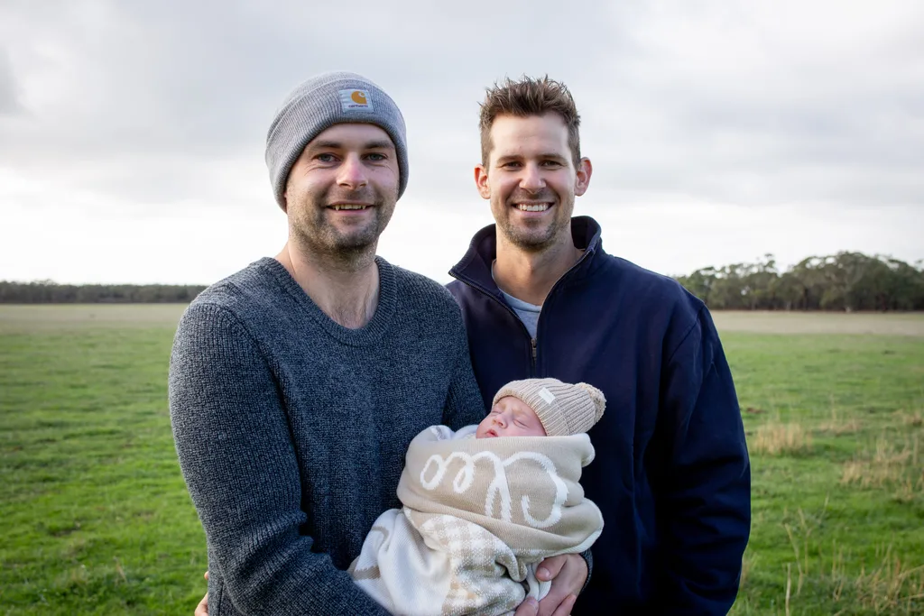 Ben, Cleo and Mason standing outside in a paddock.