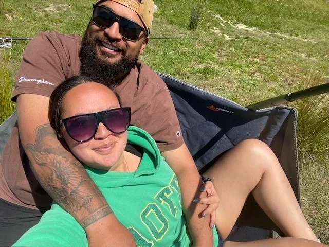 Eli and Kaylene together outside, smiling