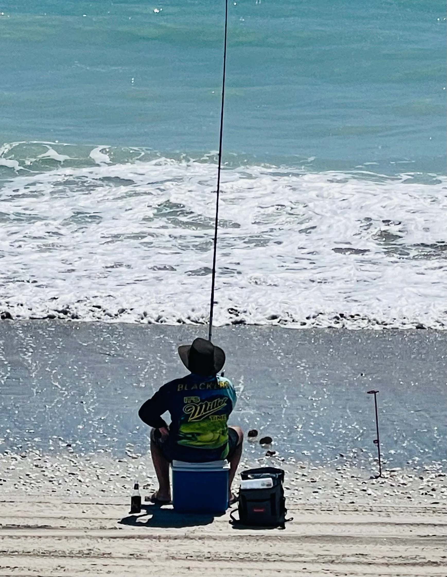 man fishing at beach