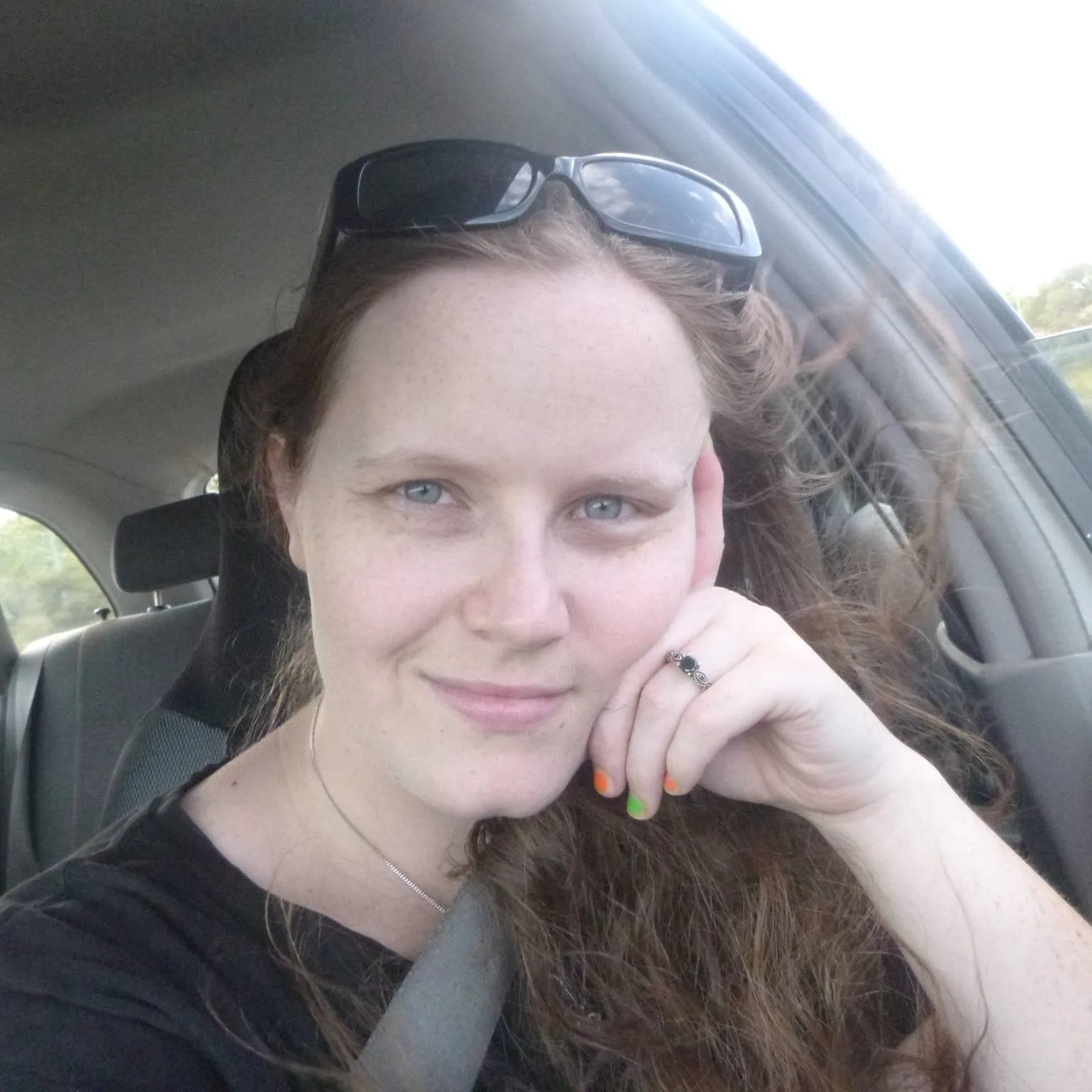 A woman sitting in a car