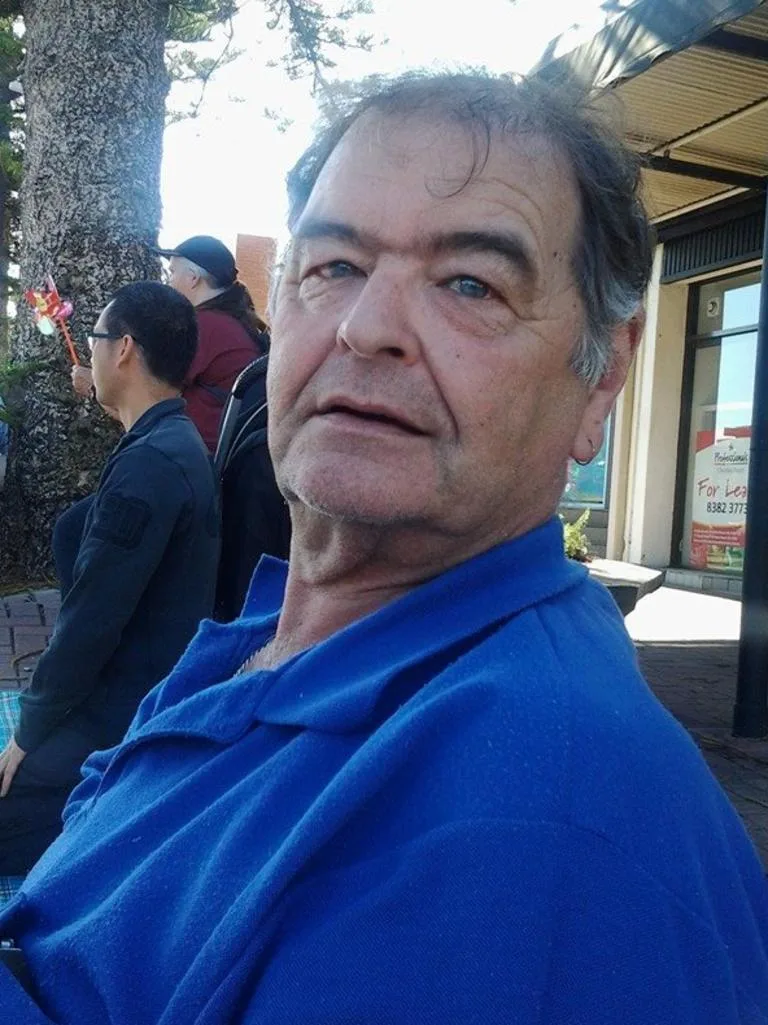 a man in a dark blue shirt