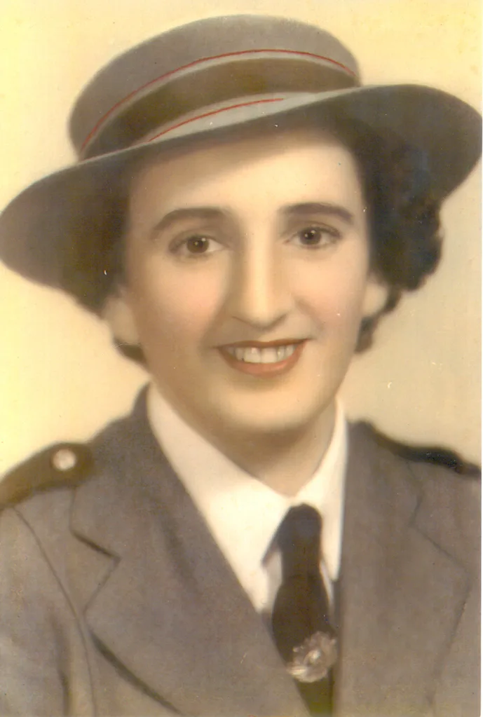 black and white photo of woman in her nursing uniform