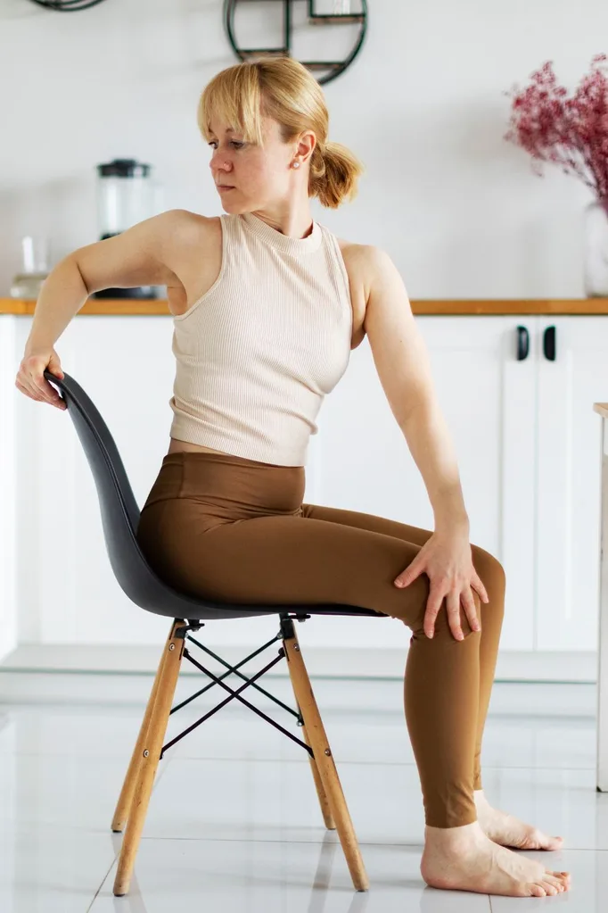 Woman stretching on chair