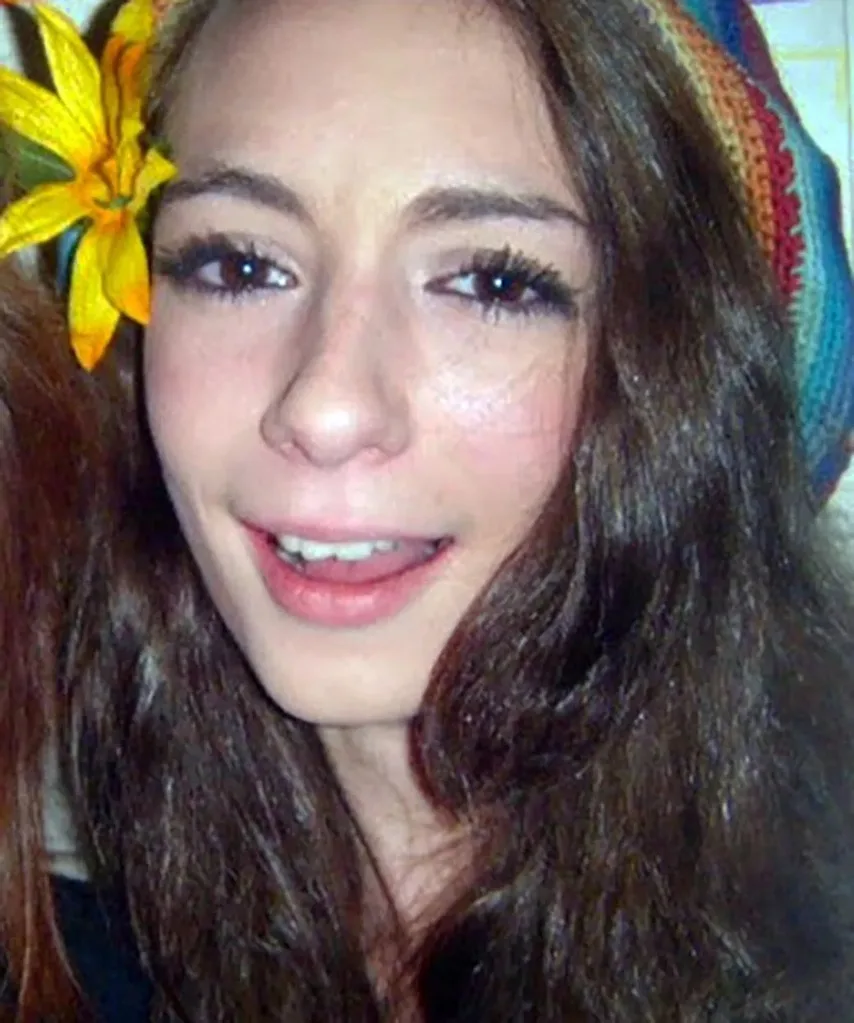 Image of woman with yellow flower in hair