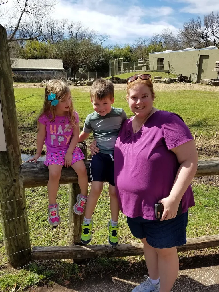Smiling woman with two children