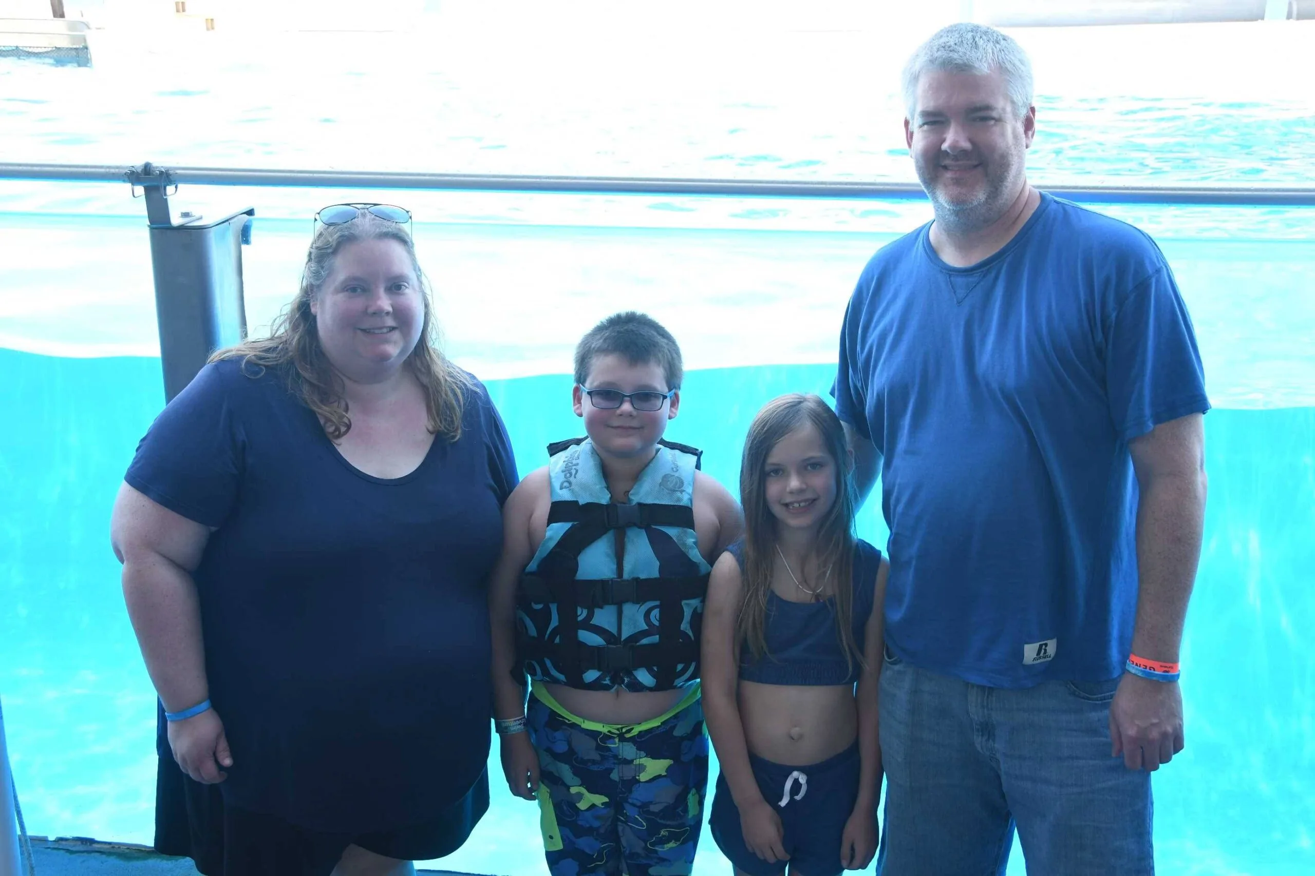 Smiling mum and dad with two children