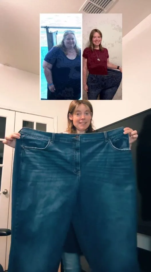 Woman holds up a pair of jeans that are too big for her