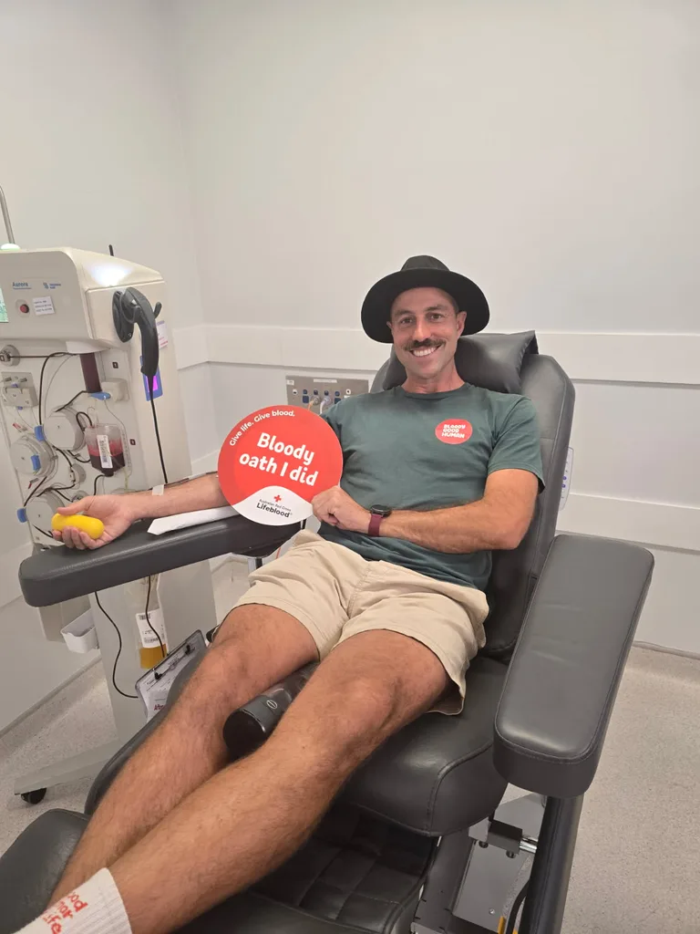 Simmo donating blood