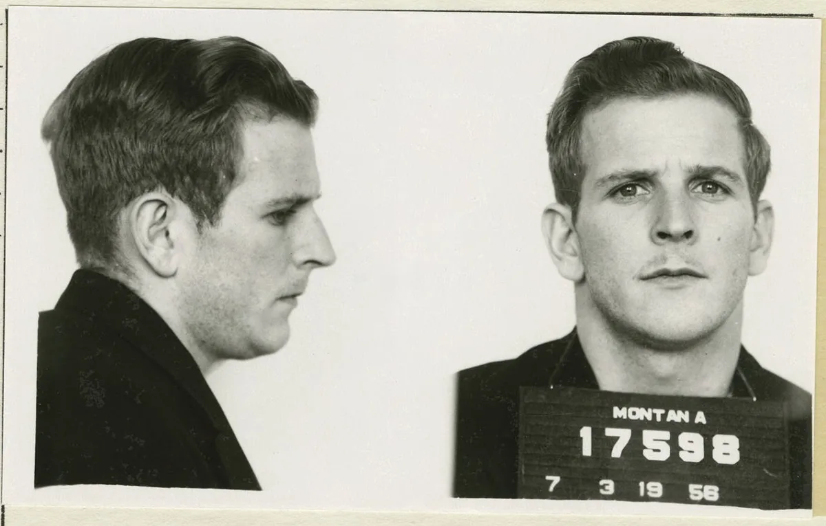 mans mugshot in black and white 