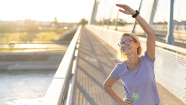 female stretching outside