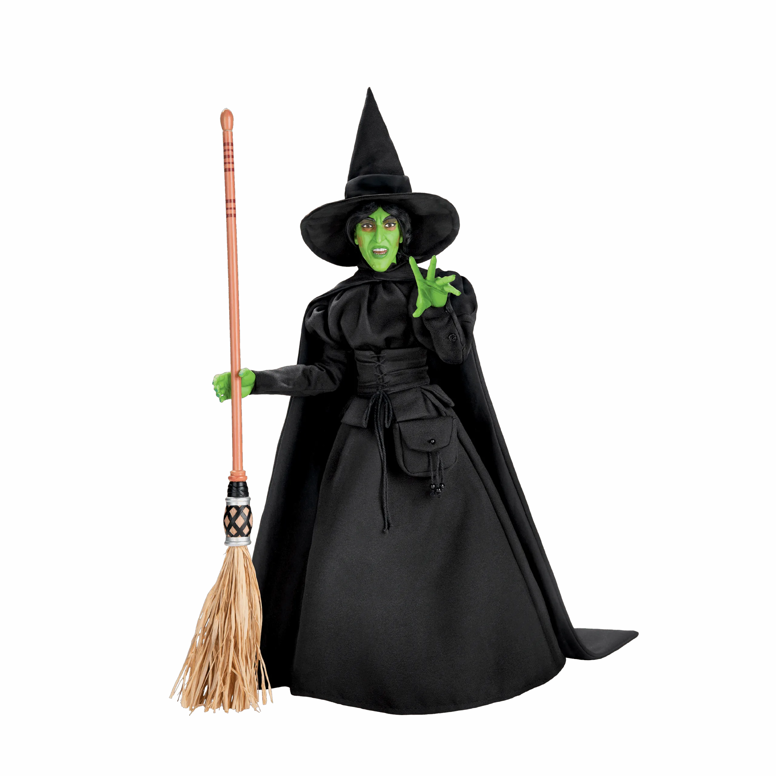 A model of a green witch with cape, hat and broom