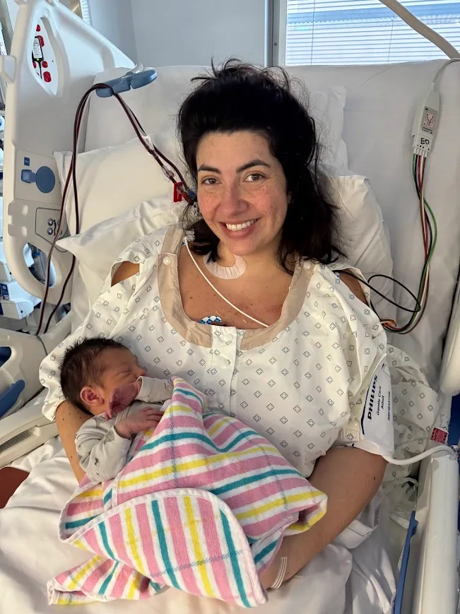 Image of woman in hospital with newborn baby