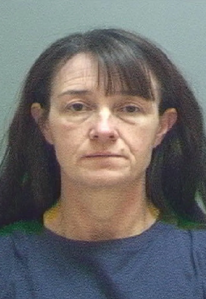 mugshot of woman in navy