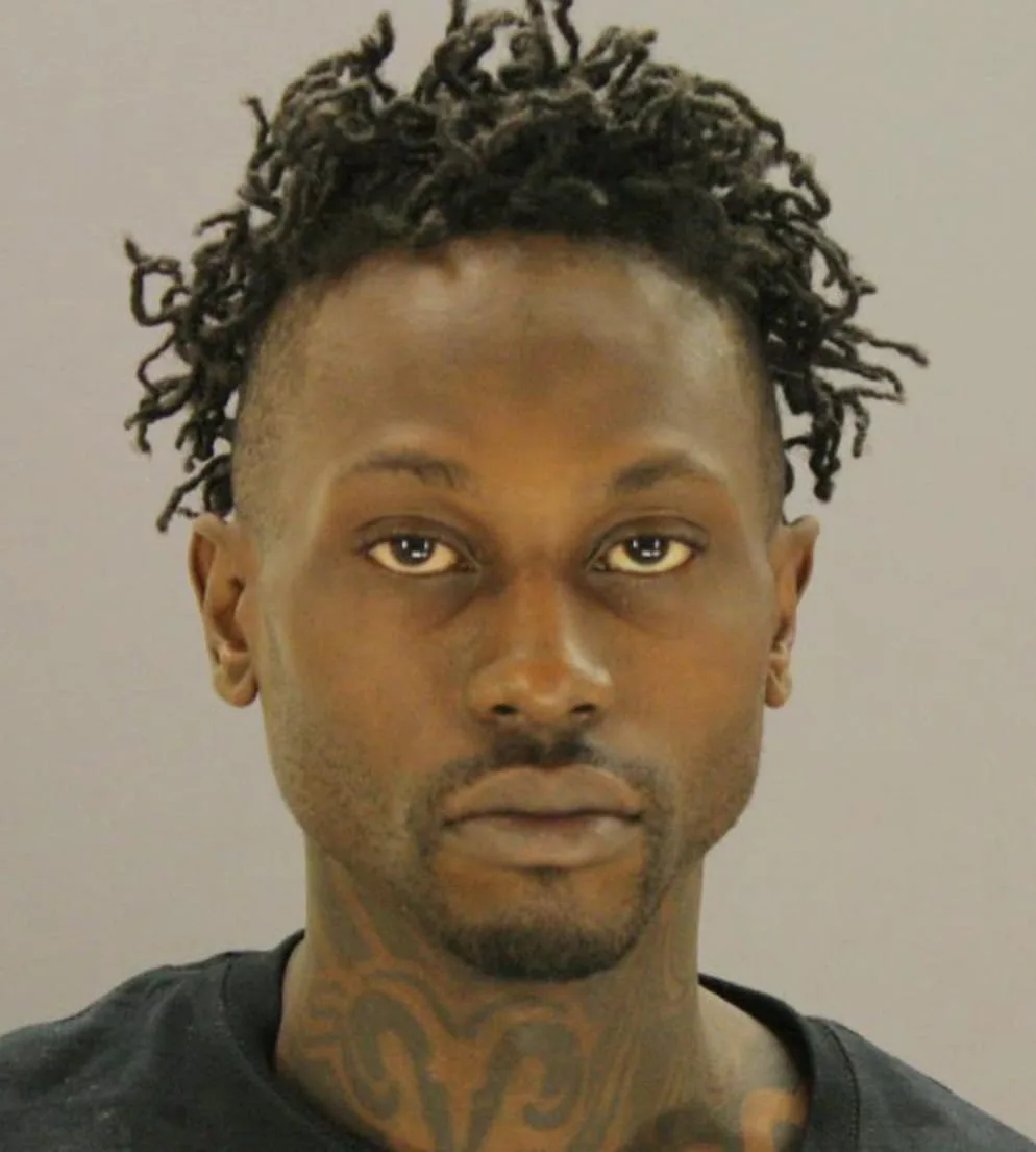 man with dark skin mugshot