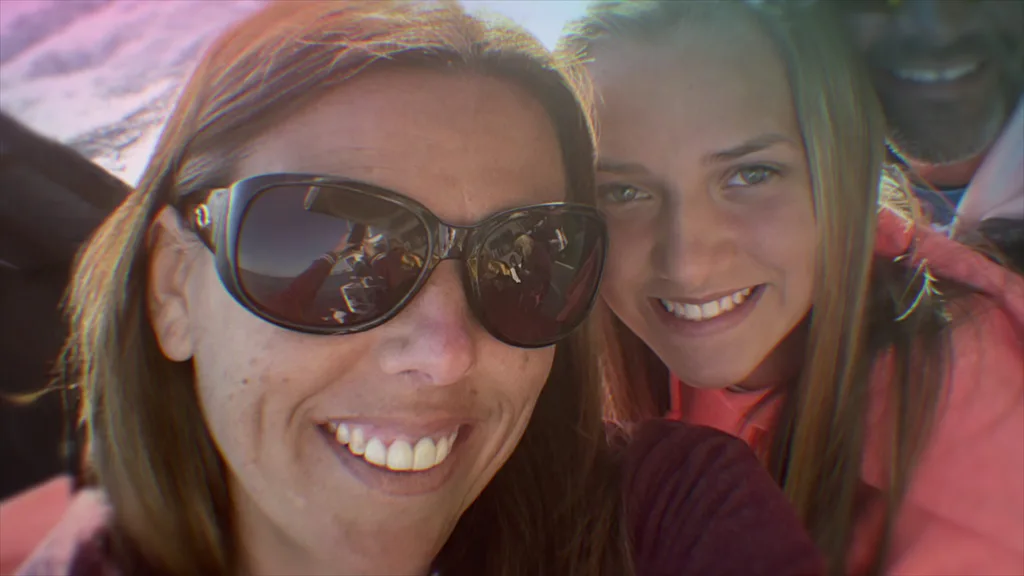 Image of mum wearing sunglasses pictured with her daughter