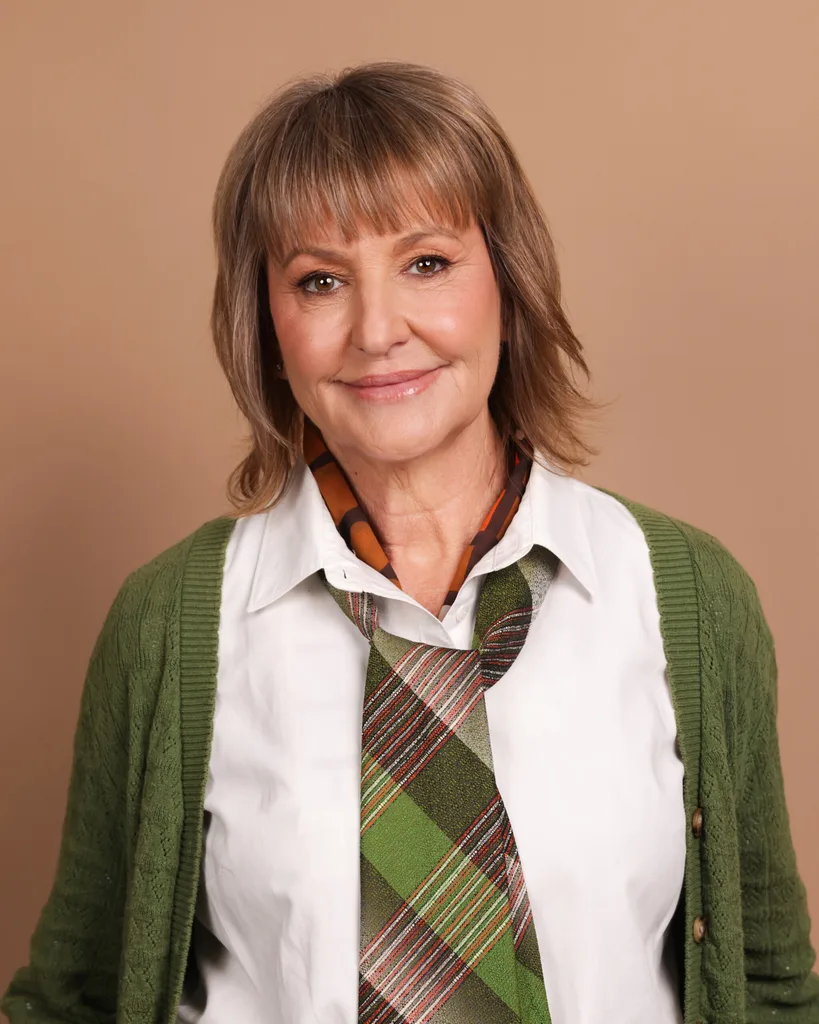 woman A in white shirt and green cardigan