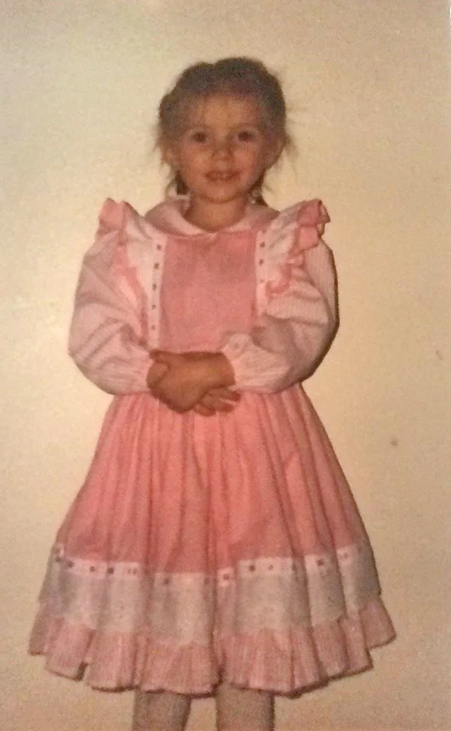 A little girl in a pink dress