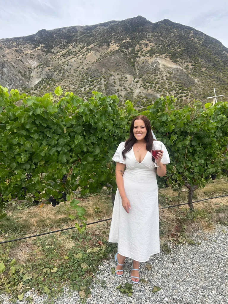 Image of woman wearing white dress after weight loss surgery