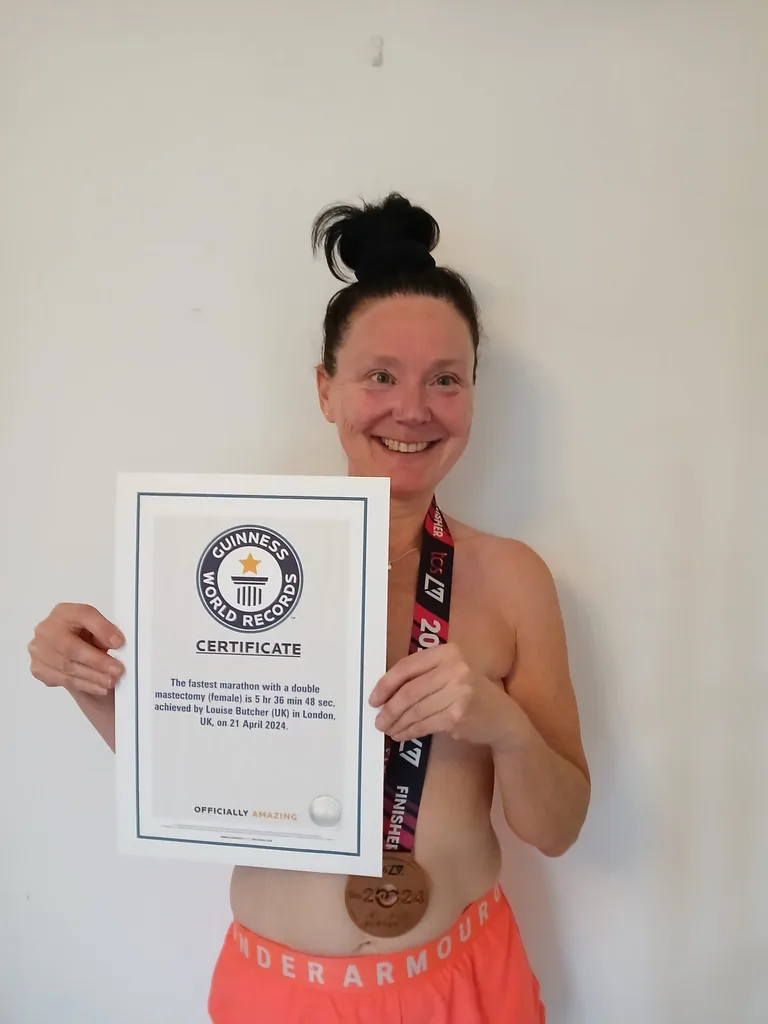 Image of woman holding Guinness world record certificate