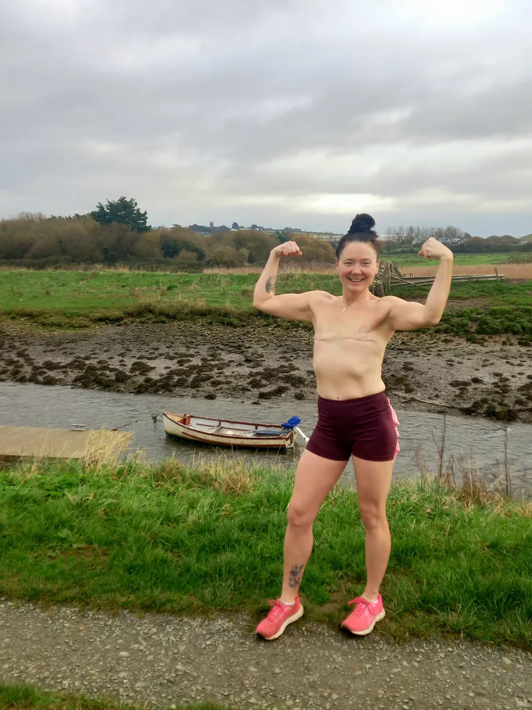 Image of topless woman flexing her muscles