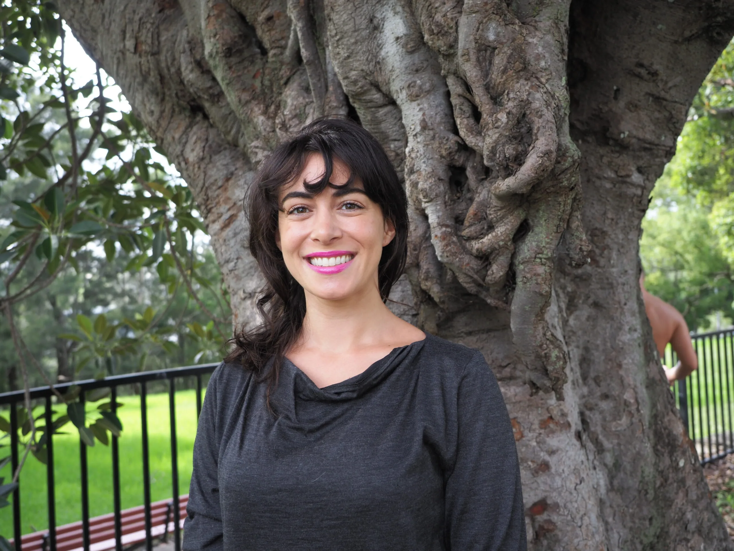 Image of dumpster diving woman smiling for the camera