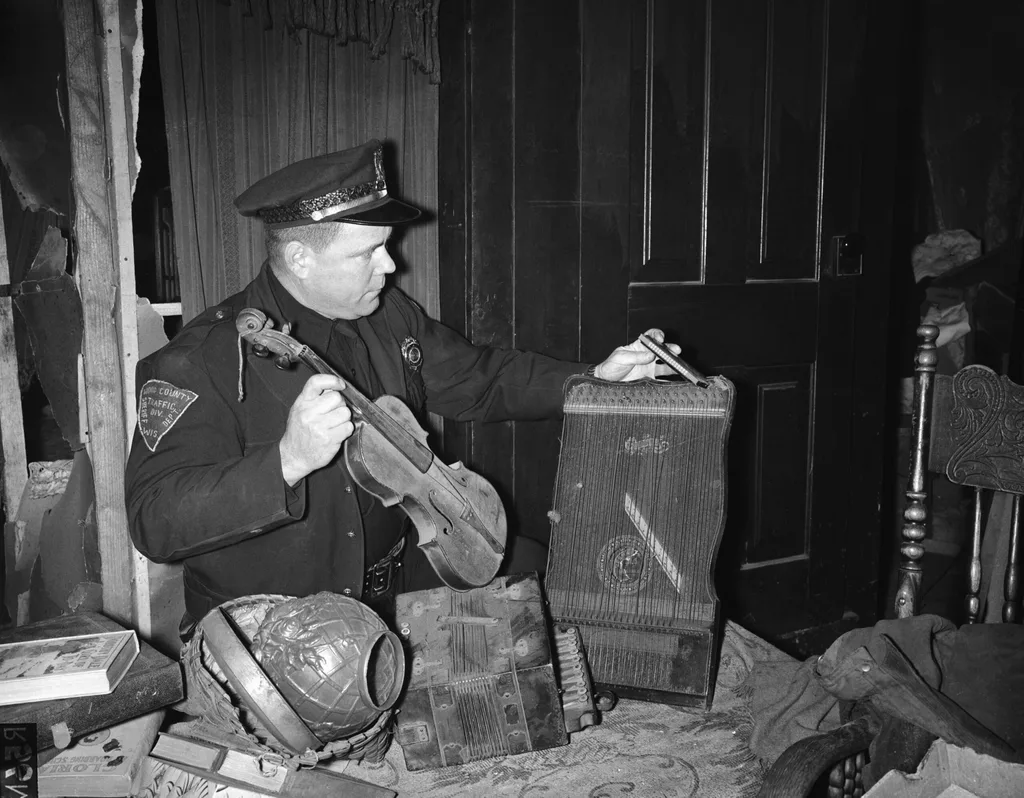 Police officer holds violin