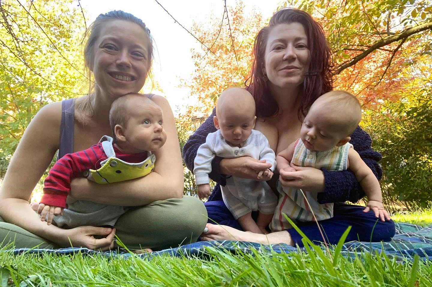 Same-sex couple Jessica and Chelsea holding Miko, Arden and Conall