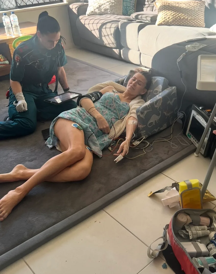 woman passed out on living room floor with paramedic 