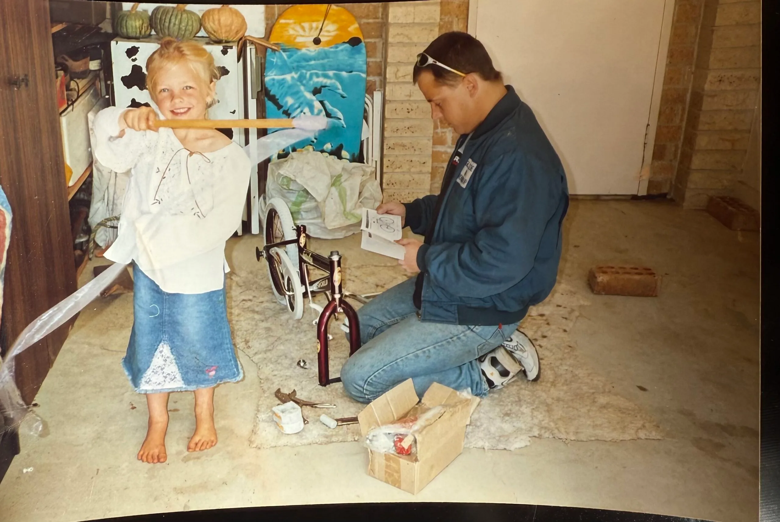 young girl with man in garage
