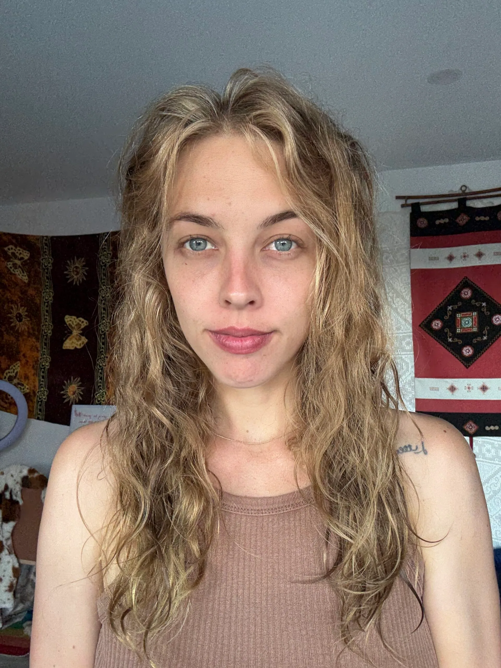 woman with blonde hair blue eyes selfie