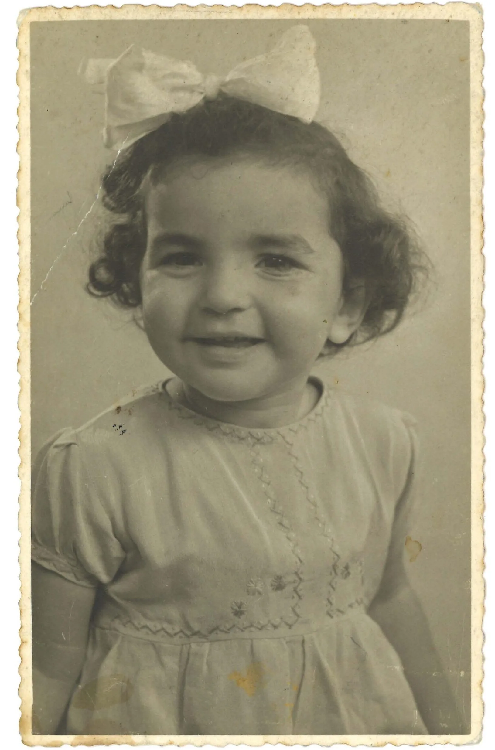 An old black and white photo of a little girl